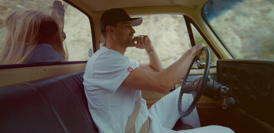 Man driving truck in white tshirt